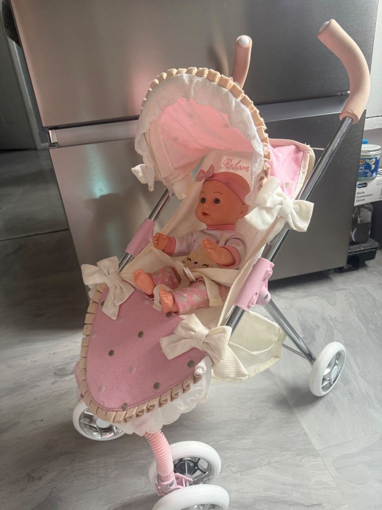 Little girls dolls buggy