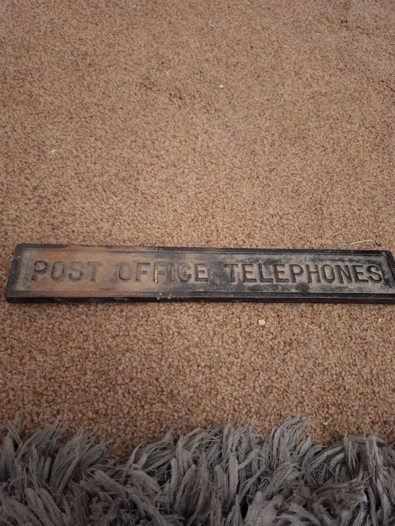 Vintage cast iron sign