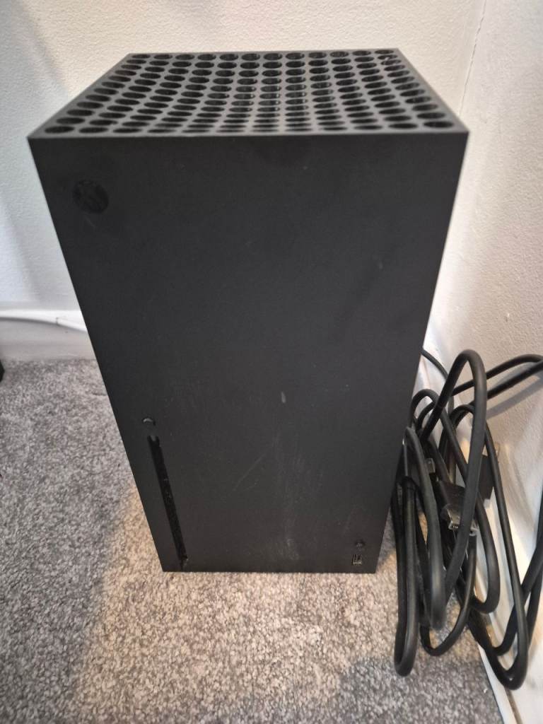 Xbox Series X w/ all leads and controller.