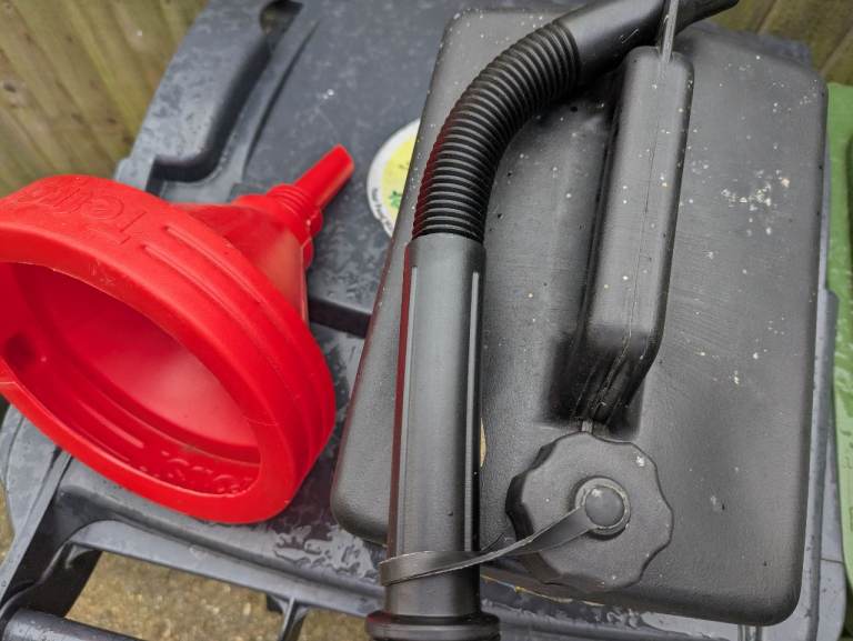 Used Diesel fuel container and funnel 