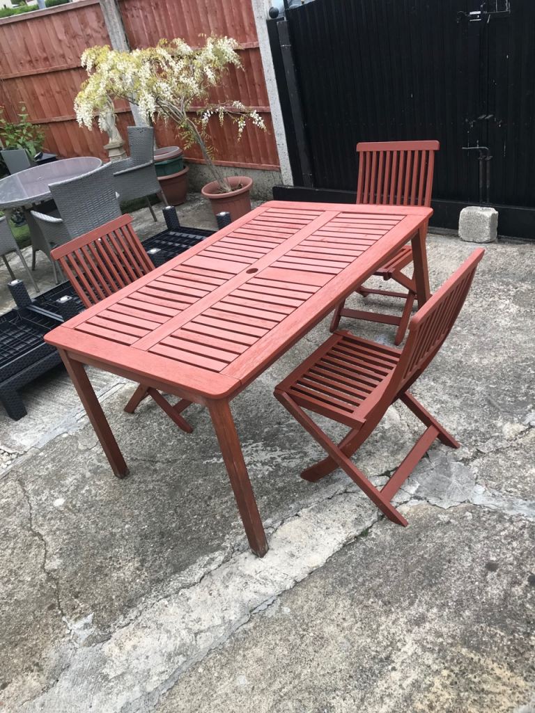 Garden table and 3 fold up chairs £30