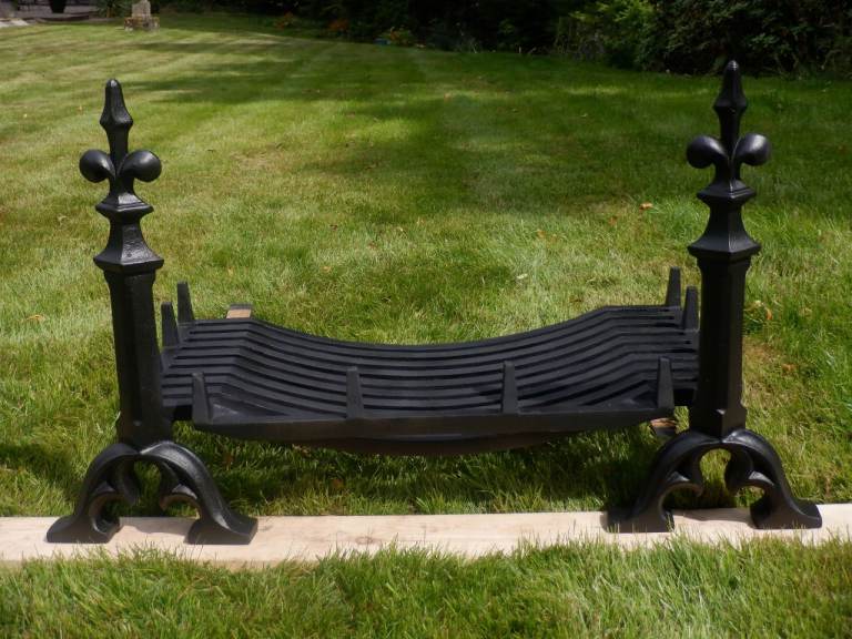 A vintage design Cast Iron Fire Basket Grate with Fleur de Lys feature Fire Dog/ Andirons