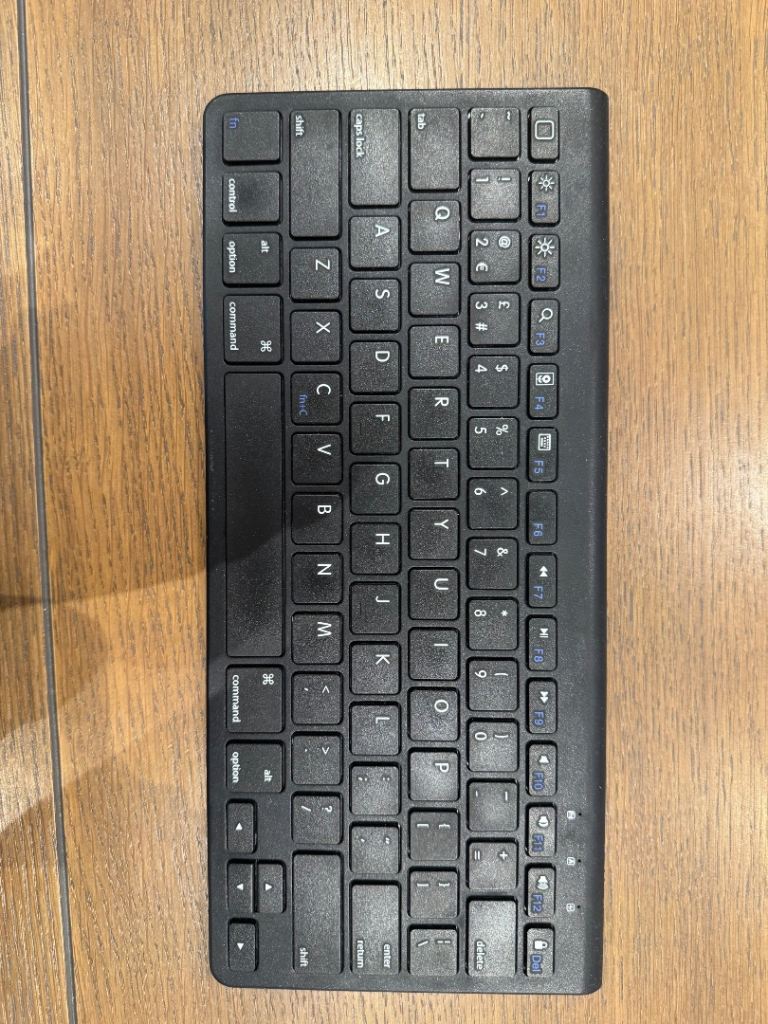 Compact Black Wireless Keyboard – Good Condition