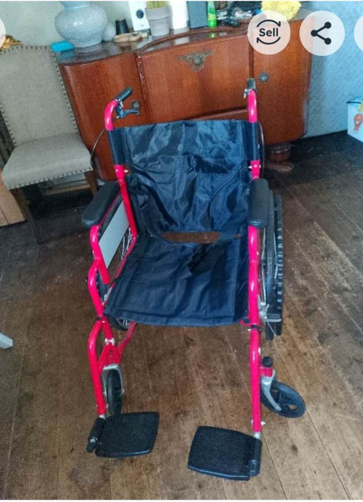 Red, collapsible adult wheelchair 
