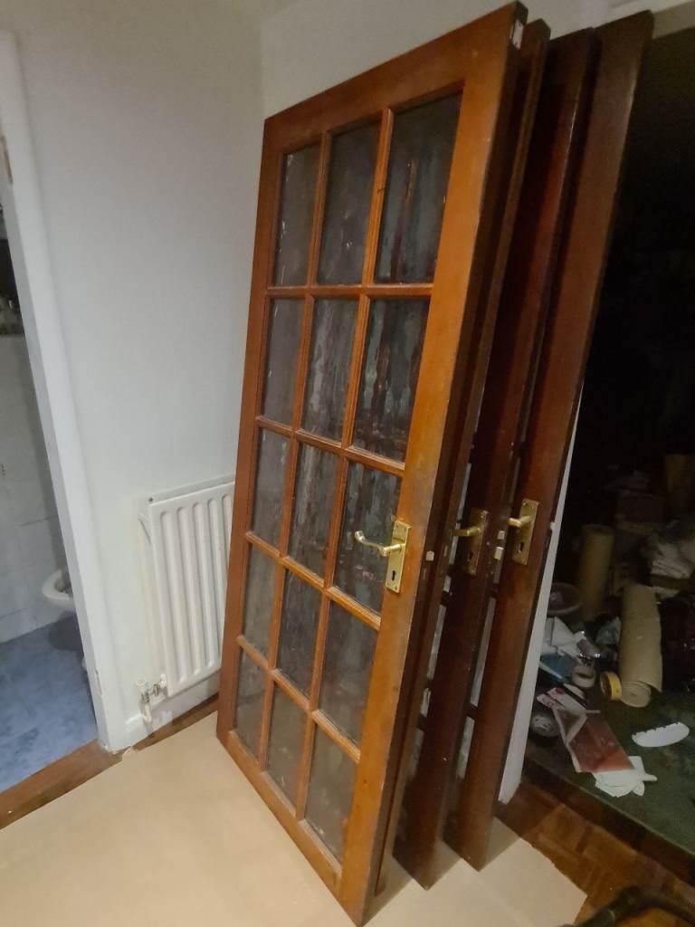 4 Wooden internal doors with glass panels. Nominally 78" x 30" 