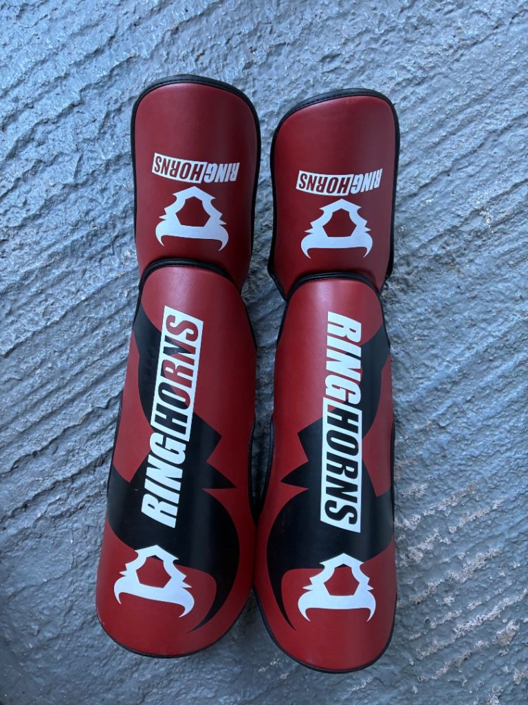 Combat sport shin and foot guards.