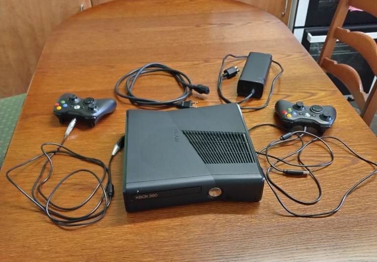 Xbox 360 game console and two handsets