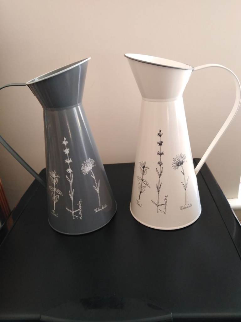 2 metal jugs