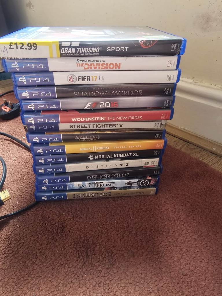 PlayStation 4 Console with 2 Controllers and 14 Games