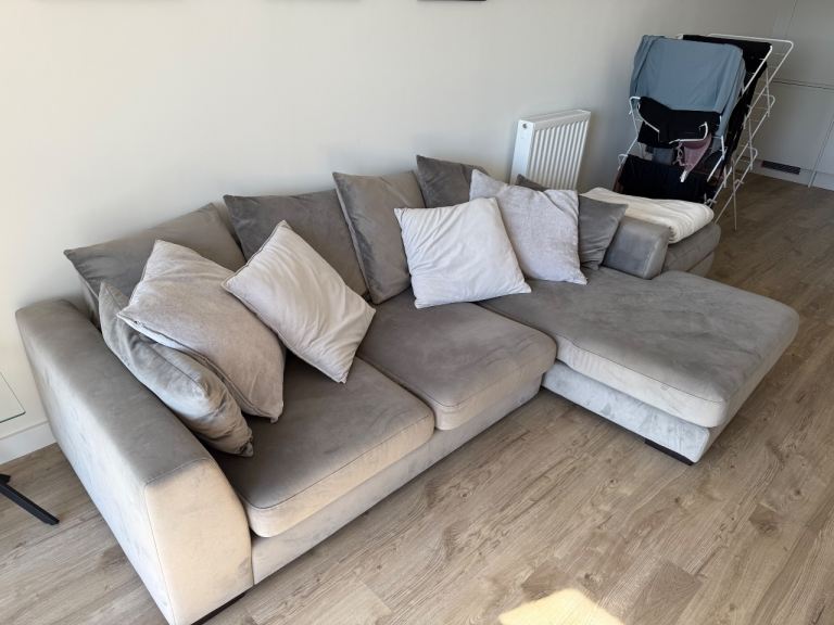 Grey corner sofa with footstool
