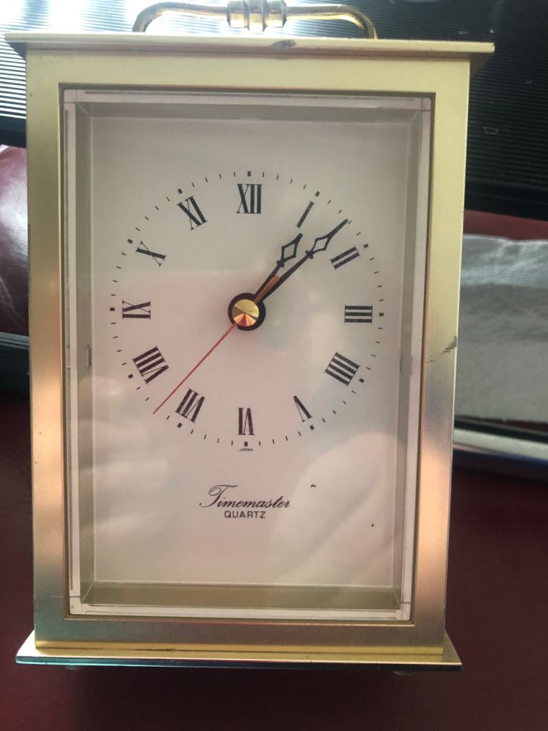 Gold coloured carriage clock 