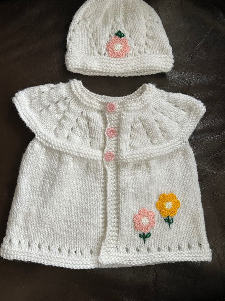 Beautiful hand knitted baby set.