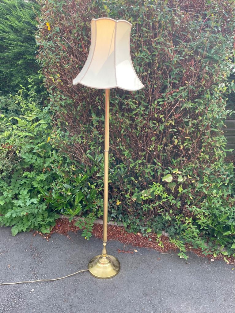 Classic brass coloured standard lamp with shade