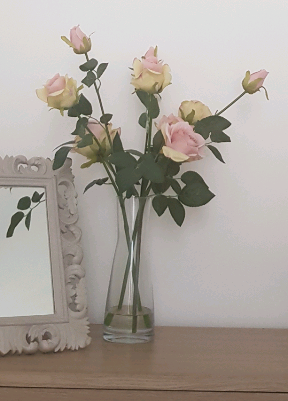 Beautiful Pink Artificial Roses Flowers in glass vase plants table 