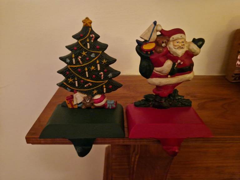 image for 2 vintage cast iron Christmas stocking hangers 