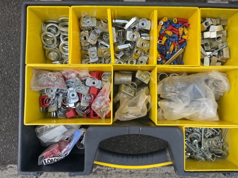 A handy toolbox filled with various screws, fixings, and electrical connectors.