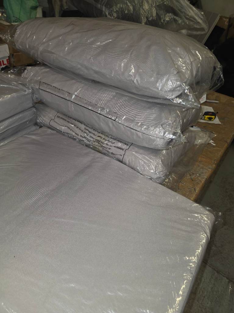 A new set of dark charcole grey garden furniture cushions it is a 9 pcs set.