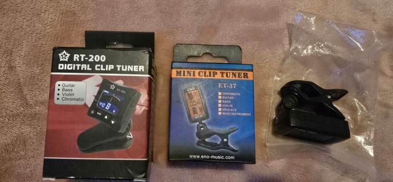 Brand New 2 Digital Guitar Tuners & Capos