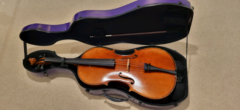1/2 Cello with bow and a purple hard case