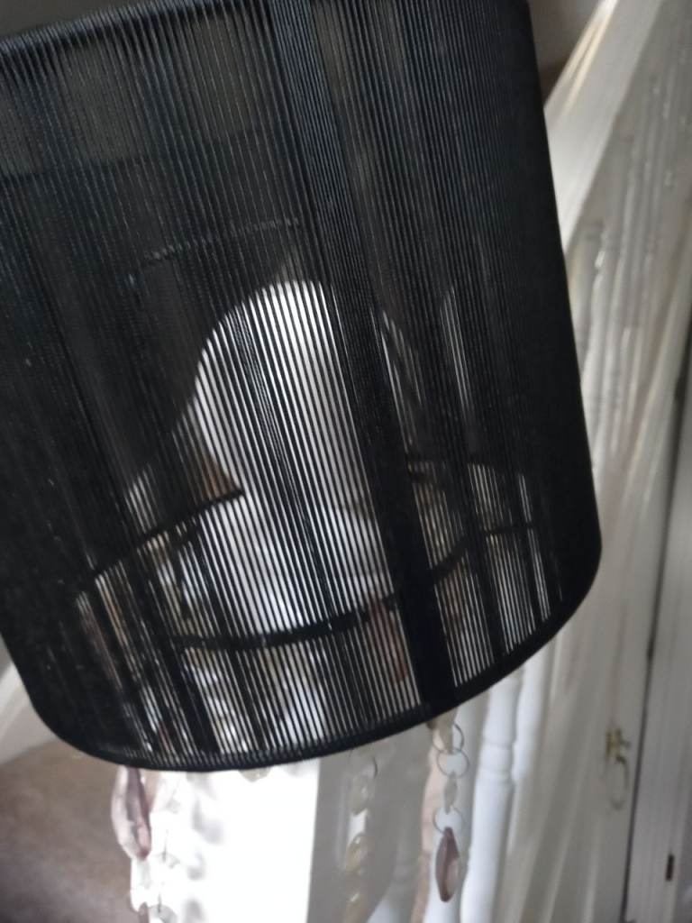 black  lamp shade with hanging plastic crystals