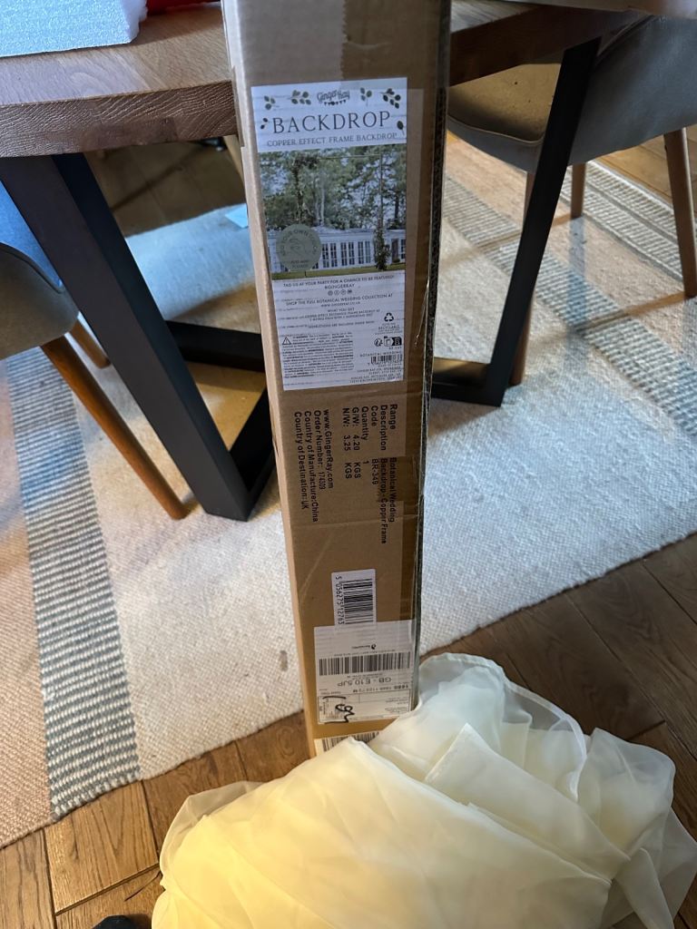 Ginger Ray Wedding arch with wedding fabric backdrop 