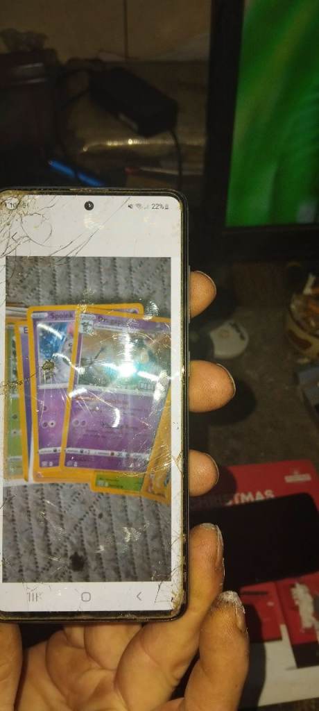 A collection of RARE pokemon cards in sleeves, and pokemon machine 