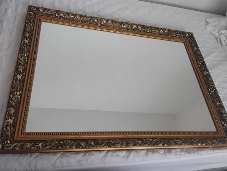 Large gold coloured decorative framed mirror 