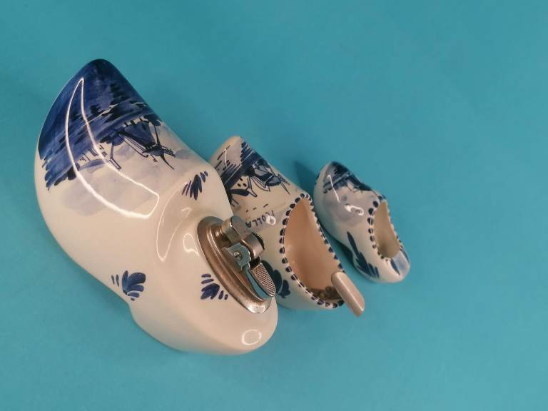 Dutch porcelain shoes,(vintage Lighter-need fill up).  ashtray shoes, delft blue shoe, hand painted.