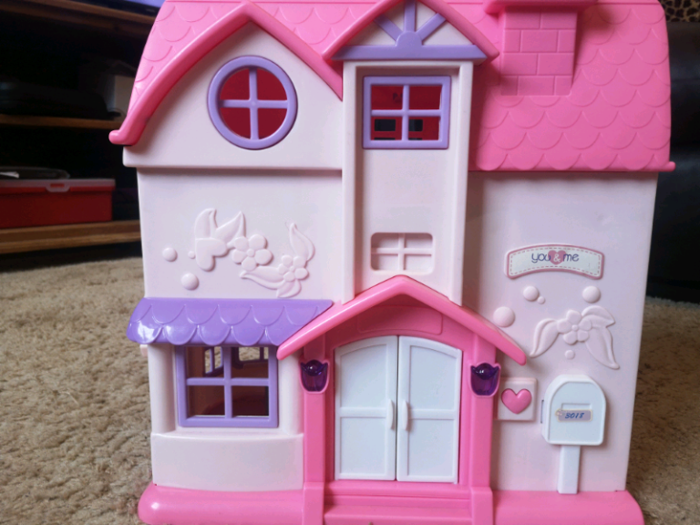 Children's toy house with figures and working doorbell