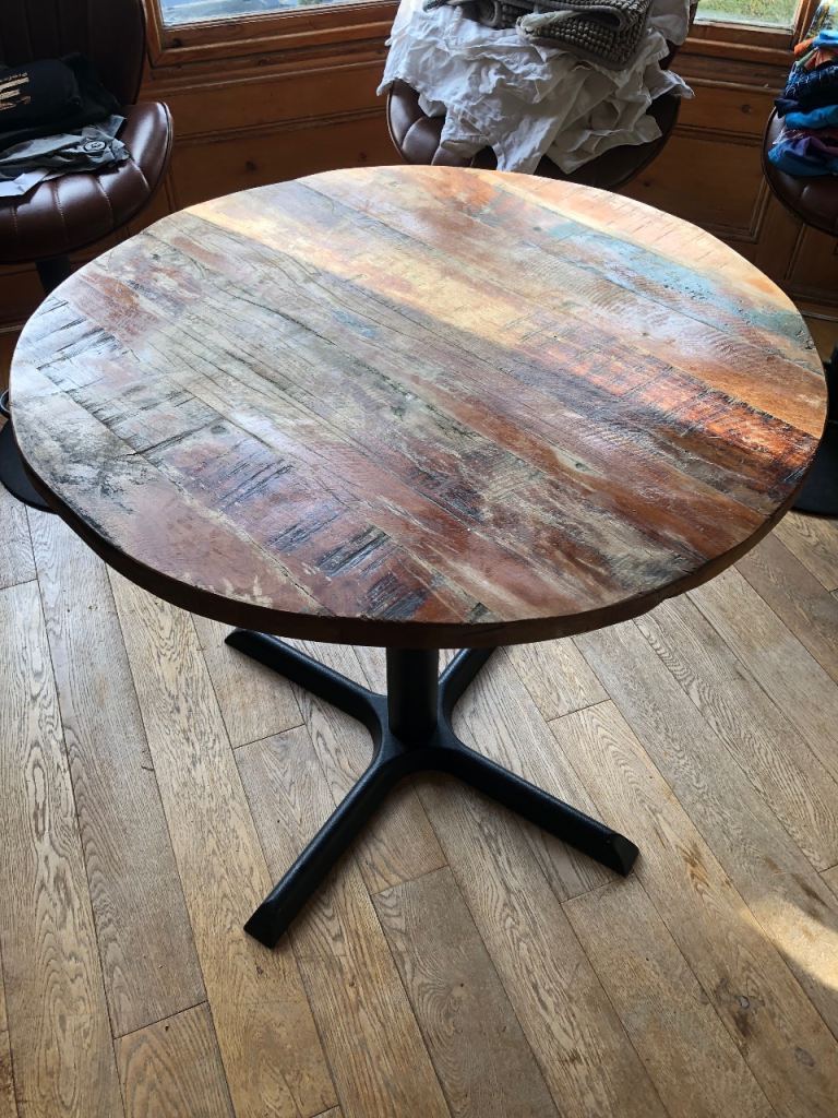 Round restaurant style wooden table