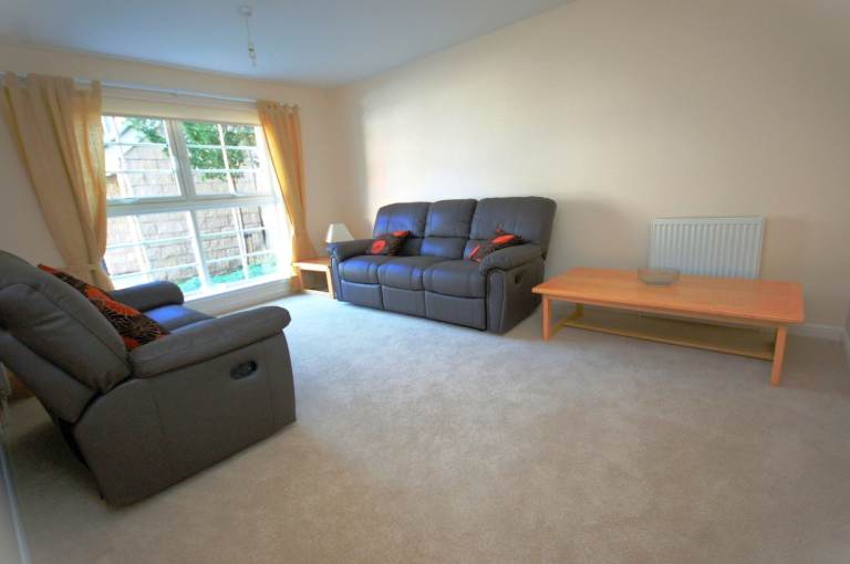 Spacious, 2 bedroom, ground floor flat with private parking, close to the Shore – available July