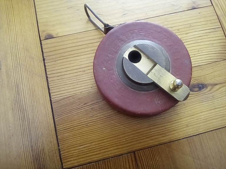 Hand tool. Quality German vintage 50ft measuring tape in leather case surround.