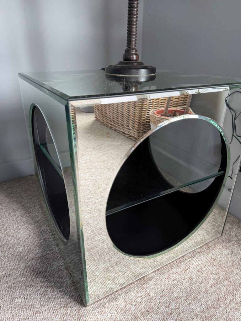 Two glass mirrored side tables