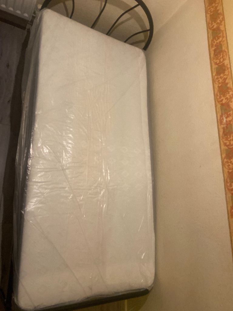 2 single beds and new mattresses 