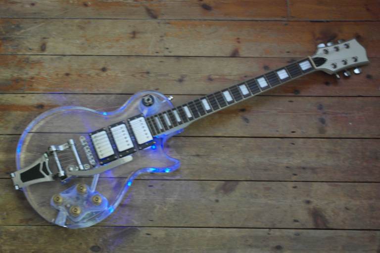 Acrylic transparent Les Paul Custom style guitar with LED lights, three pickups and Bigsby tremolo