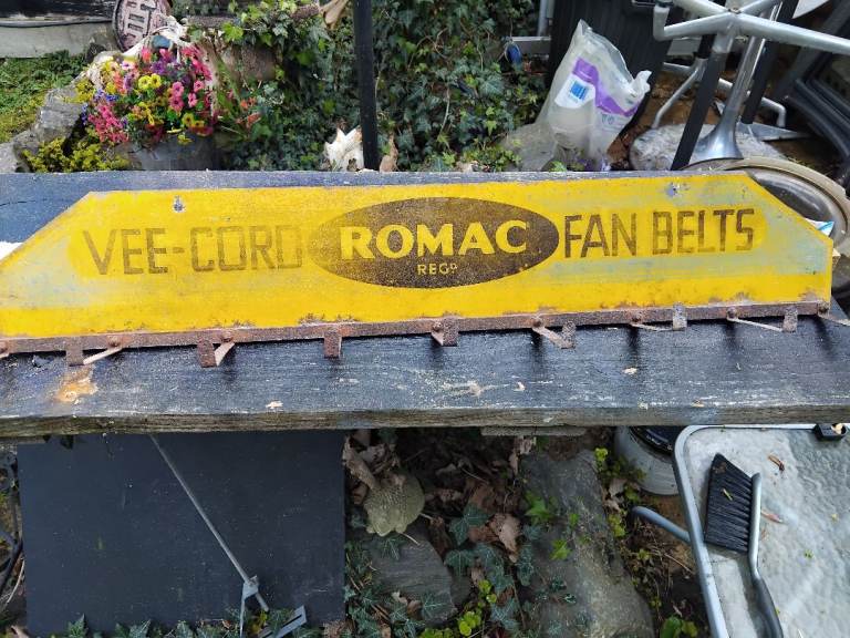 Vintage Romac vee cord fan belt display rack.
