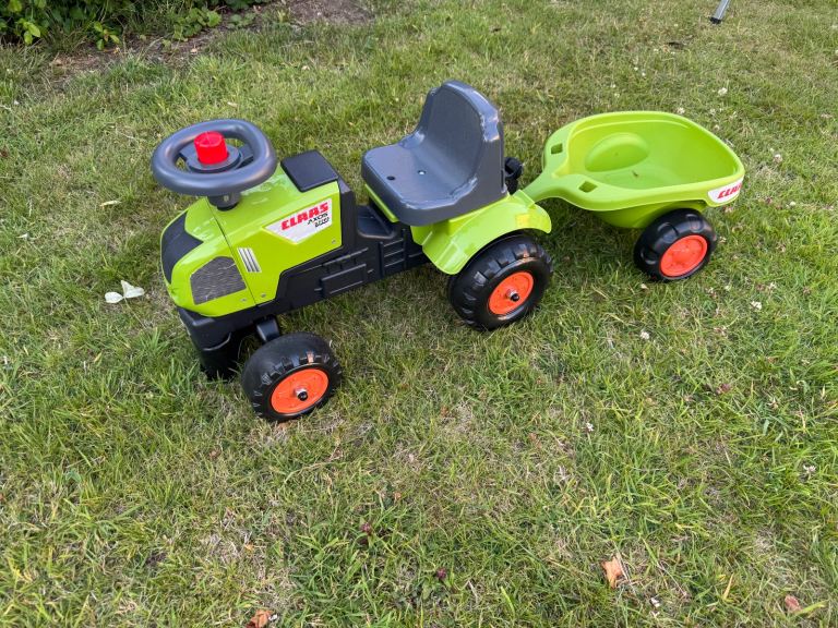 Green tractor with trailer 