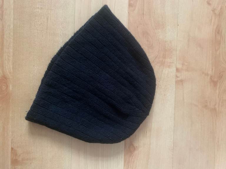 Well made,   black, ribbed   beanie   hat