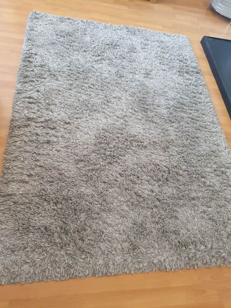 2 grey rugs
