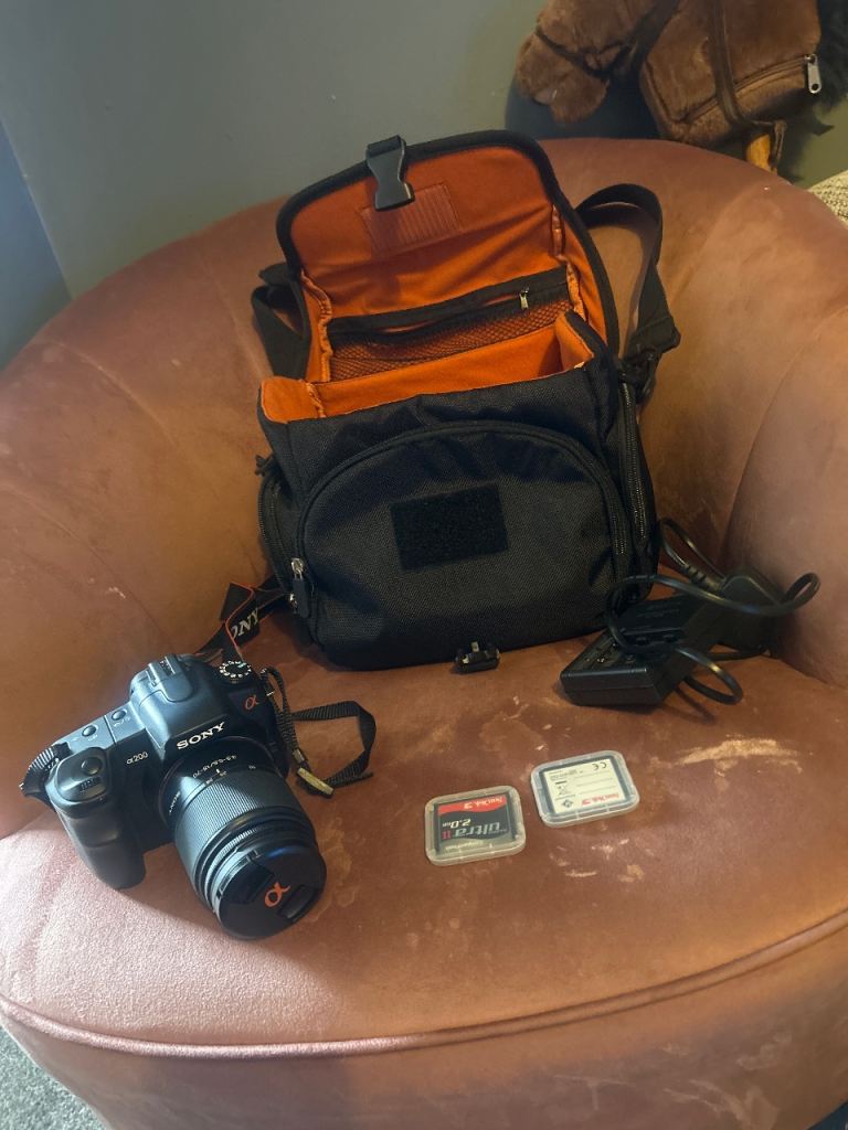 Sony A200 digital camera with zoom lens and memory cards