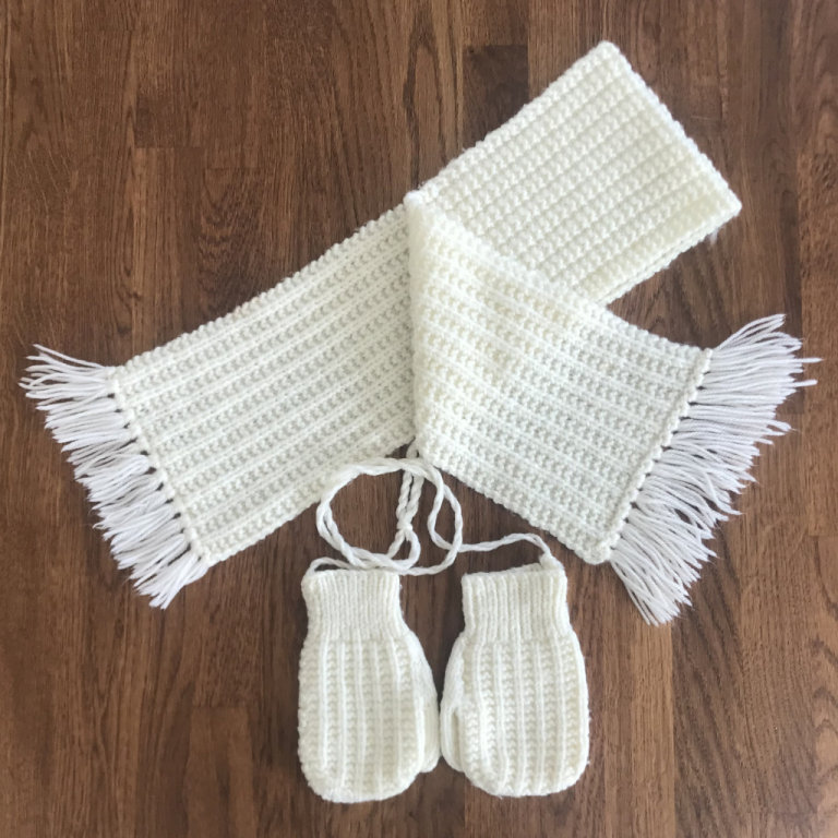 Vintage 1980's hand-knitted toddler's cream scarf and mittens on 'string'. Happy to post.