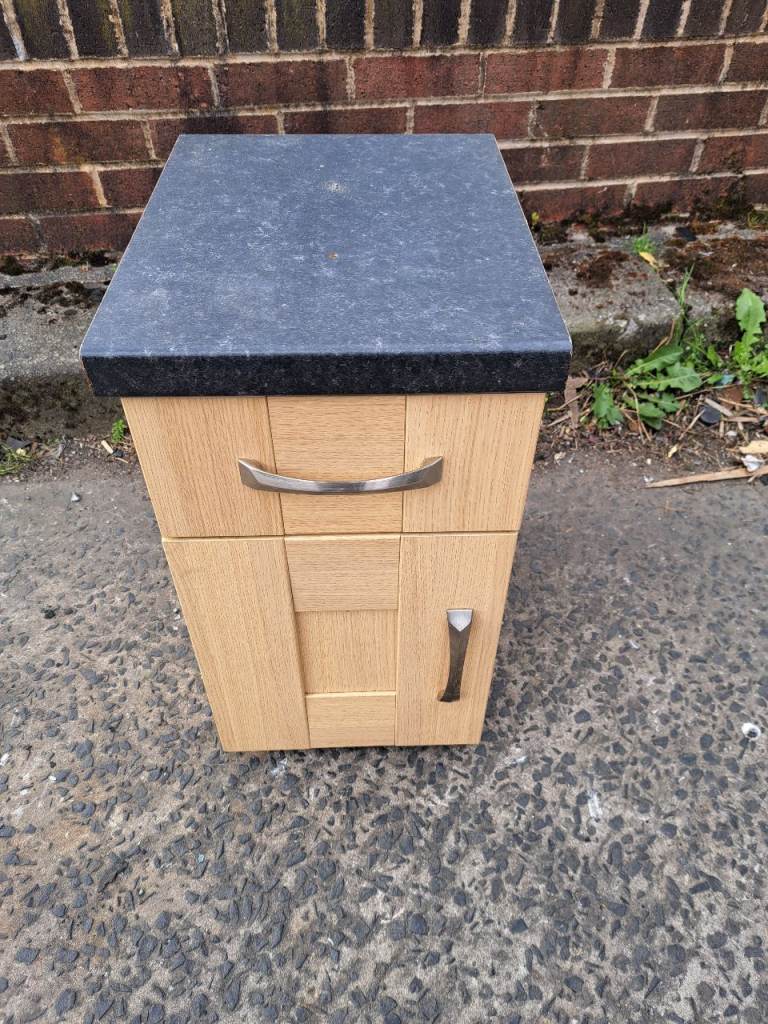 image for 1 wood bedside with black top cabinet with drawer at the top