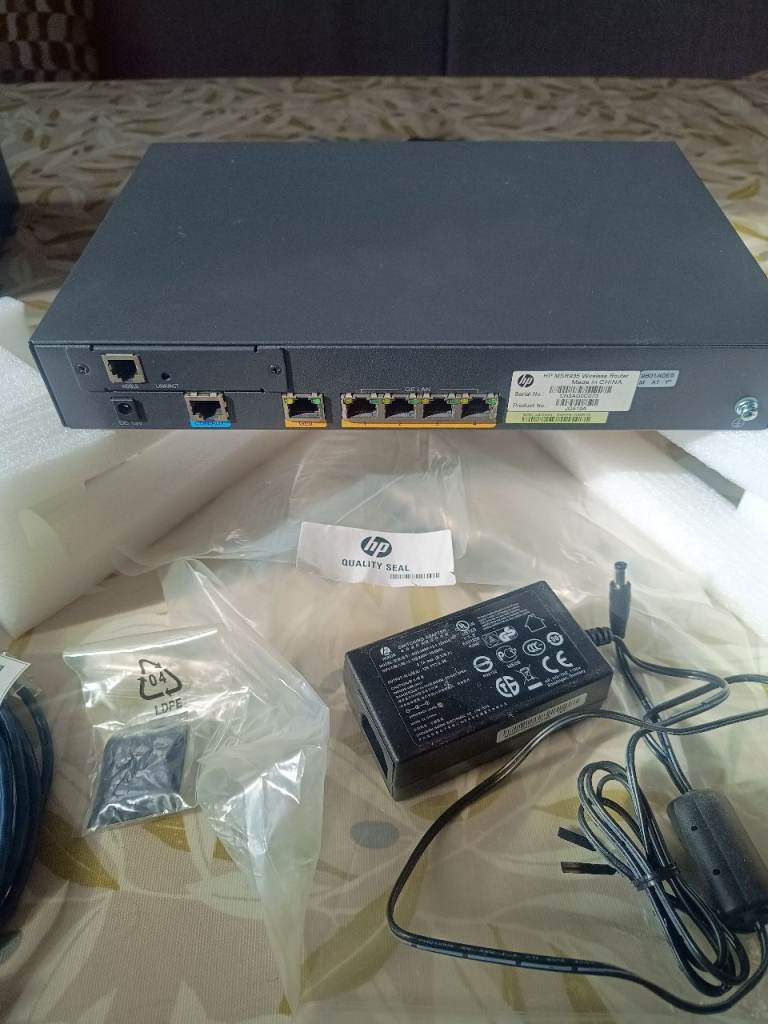 HP Network Switch with Power Adapter – Good Condition