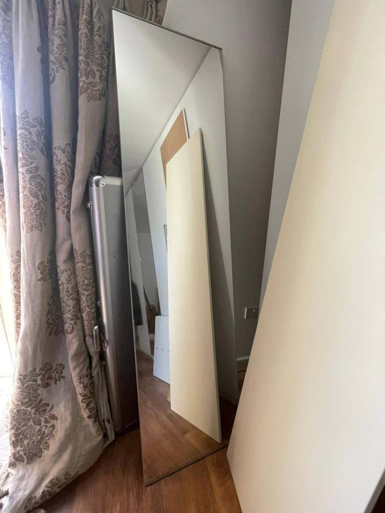 Assorted IKEA wardrobe parts, including old doors and a mirror