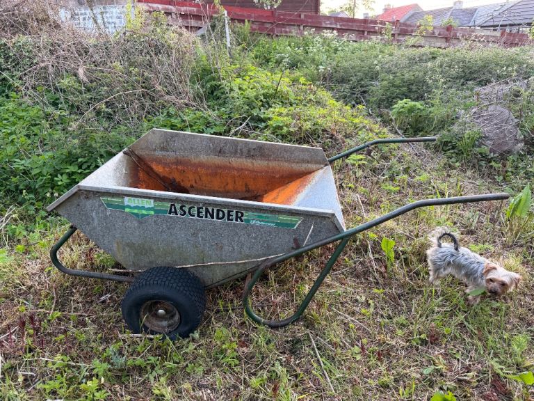 Tipping wheelbarrow trailer with tow bar