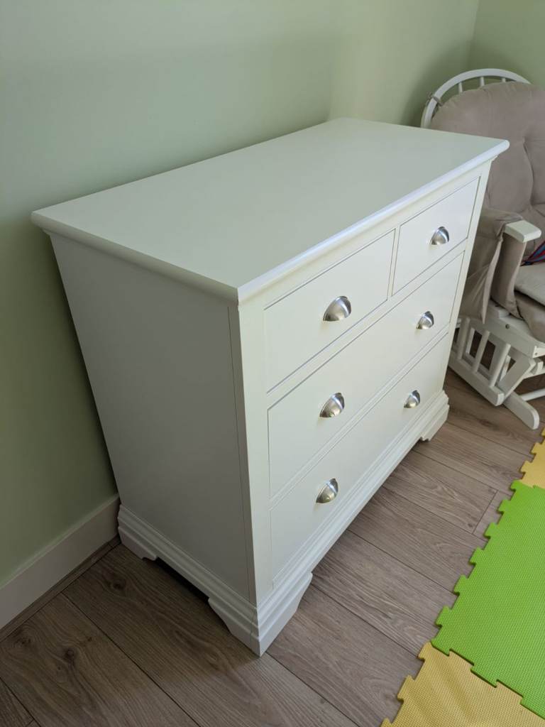 Cream two-door wardrobe and matching chest of drawers