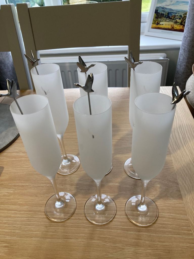 Grey goose glass flutes with Stirers to match.