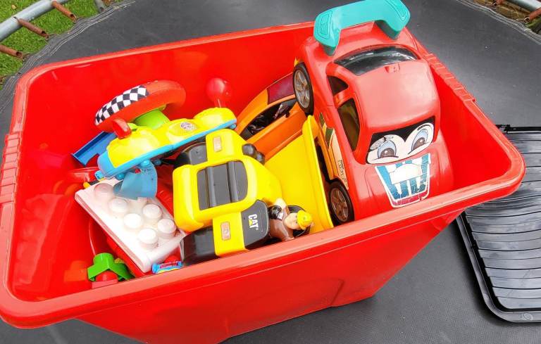 Box of assorted toy cars.