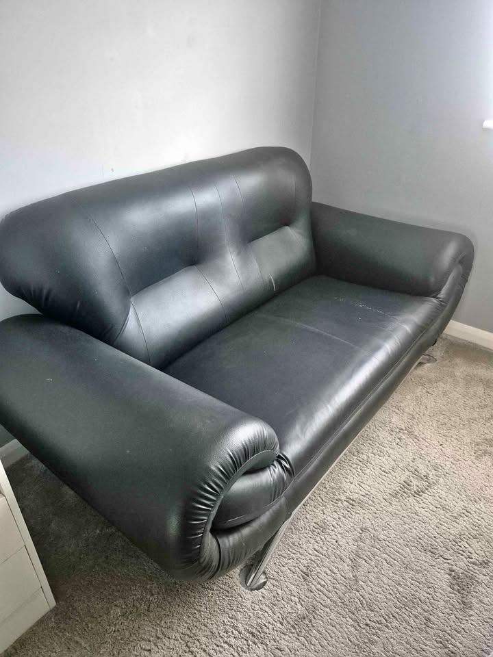 Black faux leather sofa