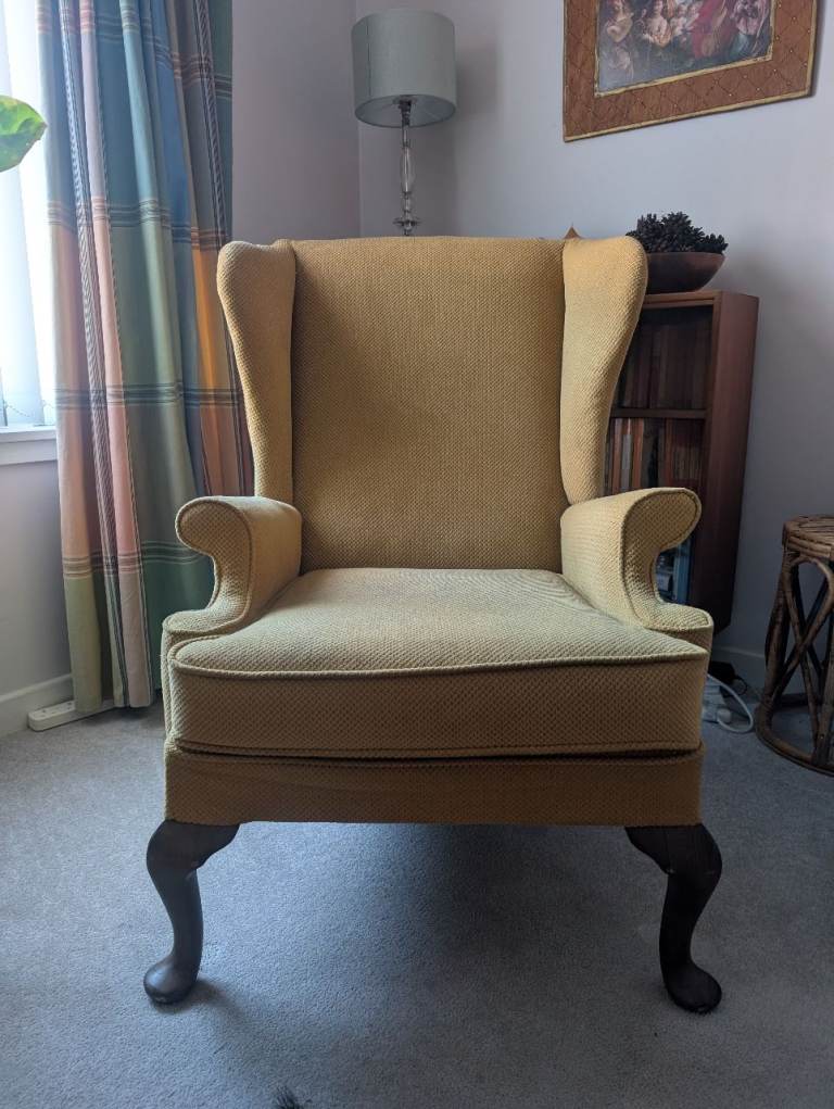 A classic mid-century Parker Knoll wingback chair (Model P.K. 976).